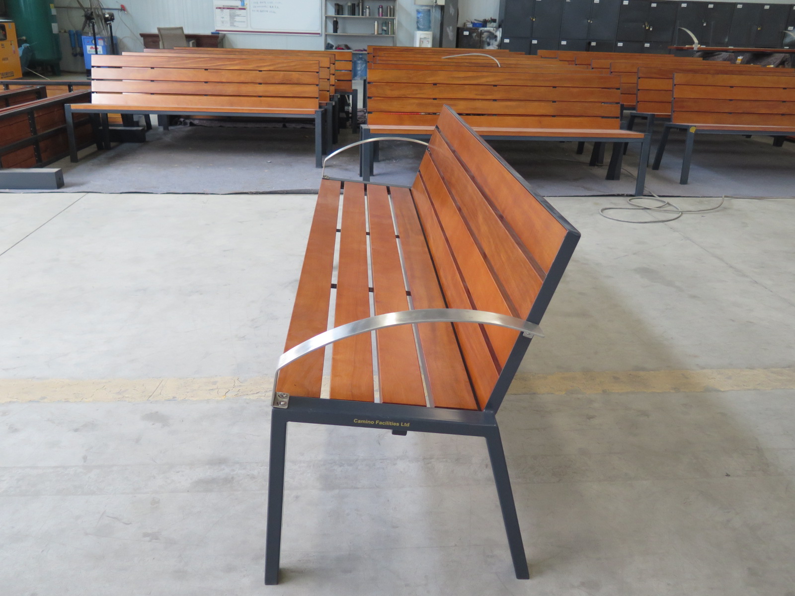 Weather-resistant outdoor wooden bench with ergonomic backrest for patio seating